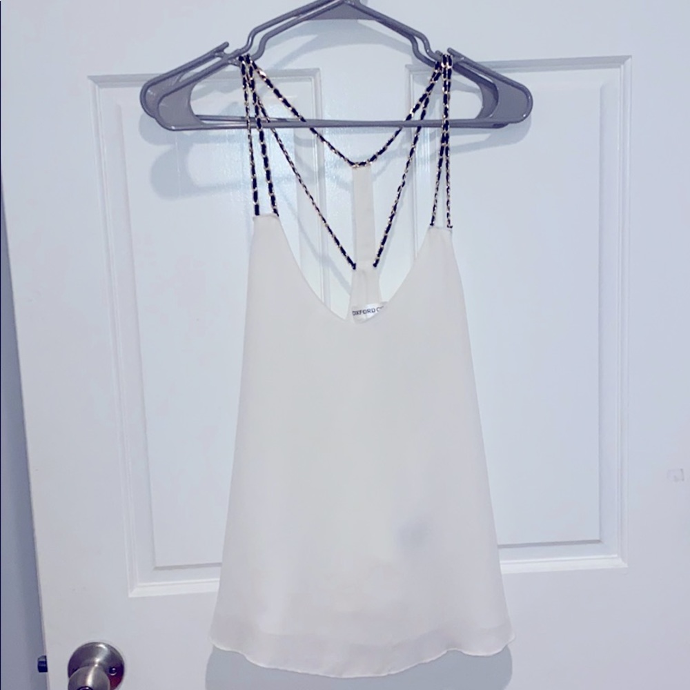 White top with gold black chain straps